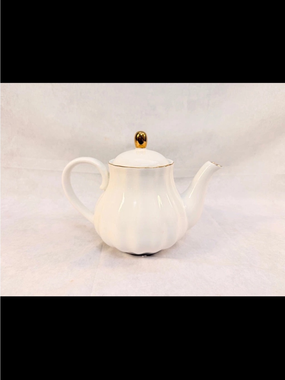 White Porcelain Teapot with Gold Trim and Knob